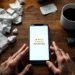 Smartphone displaying one-star rating on wooden desk with scattered rejection letters and worried business owner's hands
