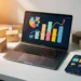 Laptop met kleurrijke verkoopgrafieken op wit bureau, omringd door productdozen en smartphone met marketplace-dashboard.