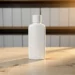 Sleek white minimalist bottle on light oak surface, warm golden side lighting, soft-focus warehouse shelves in background.