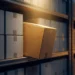 Single product box spotlit in warm golden light among rows of grey boxes on a warehouse shelf, symbolizing product differentiation.